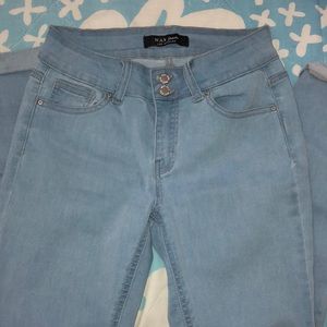 Light blue wax jeans that  are cuffed